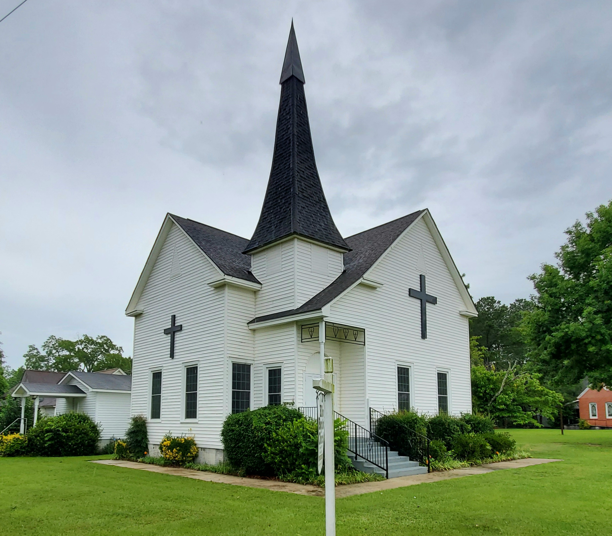 Elko Baptist Church building exterior, with its white siding and steeple, in Elko, Georgia